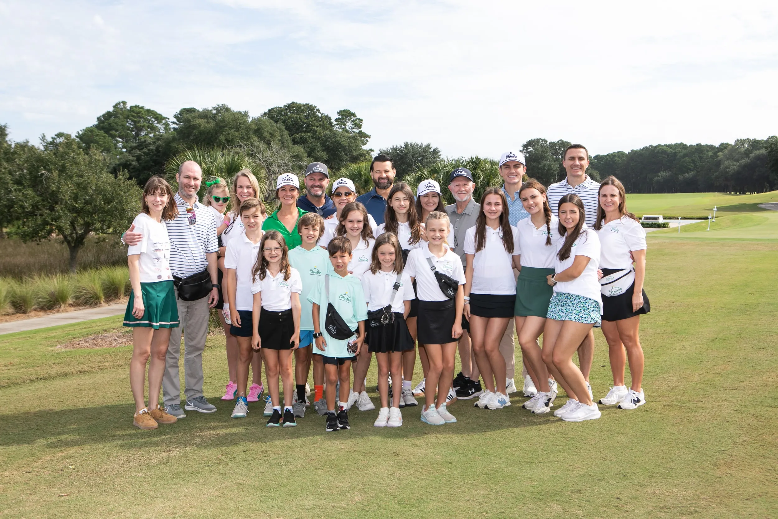 The Fanny Pack Foundation family gathered on the course at Daniel Island Club, many wearing fanny packs